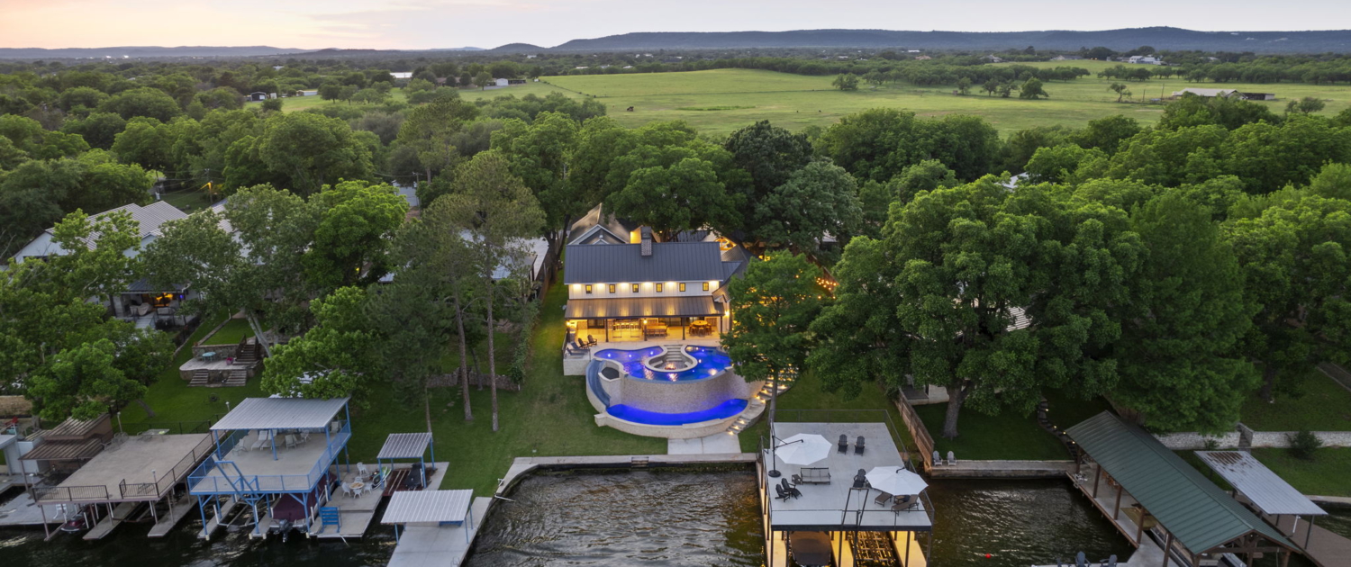 Luxury lakeside estate aerial drone photo by Austin Real Estate