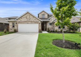 Single-family home exterior with driveway and three-car garage