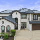 Two-story Leander home exterior with solar panels