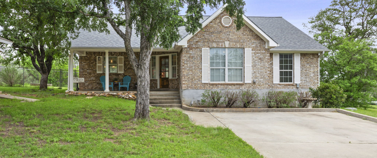 2-web-or-mls-113-scenic-dr Brick Horseshoe Bay home exterior with front porch